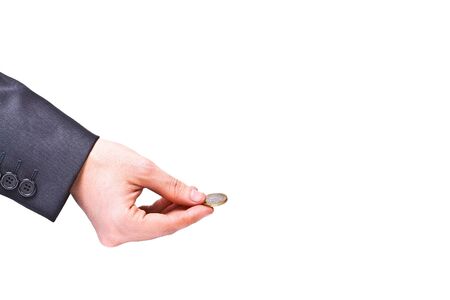 Hand gives coin isolated on white backgroundの写真素材