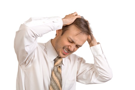 Young office worker in white shirt suffers from stressの写真素材