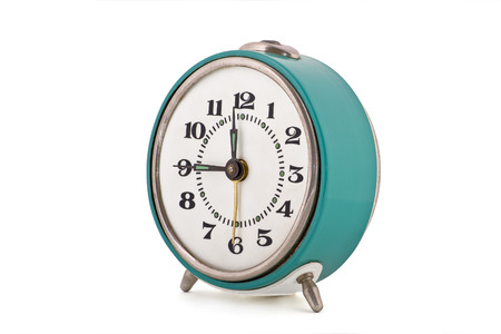 Side shot of old soviet mechanical alarm clock isolated on white backgroundの写真素材