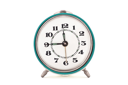 Front shot of old soviet mechanical alarm clock isolated on white backgroundの写真素材