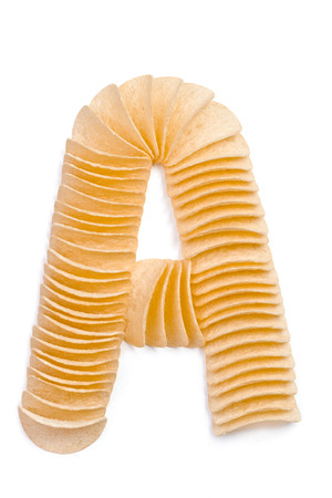 Letter A composed of chips isolated on white backgroundの写真素材