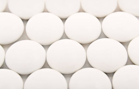 Background with rows of medical tablets - macro shotの写真素材