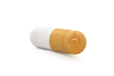 Macro shot of pill with medical drug insideの写真素材