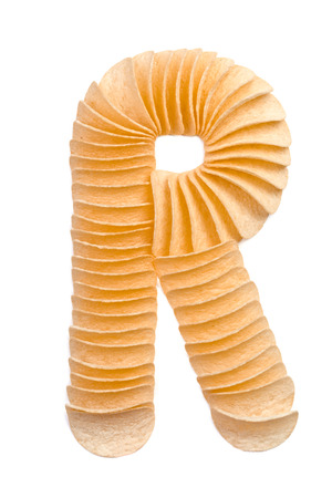 Letter R composed of chips isolated on white backgroundの写真素材