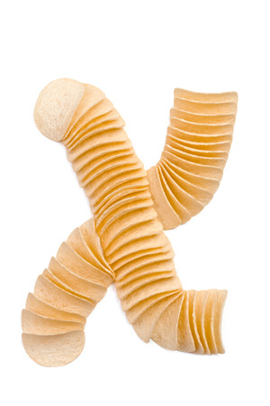 Letter X composed of chips isolated on white backgroundの写真素材
