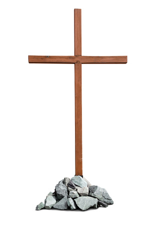 Wooden cross with pile of stones isolated on white backgroundの写真素材