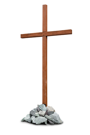 Wooden cross with pile of stones isolated on white backgroundの写真素材