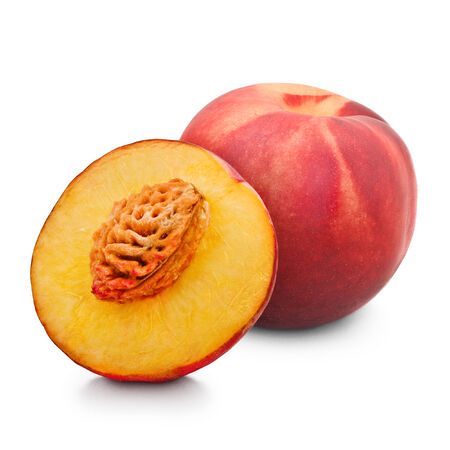 One and half red peach isolated on white backgroundの写真素材