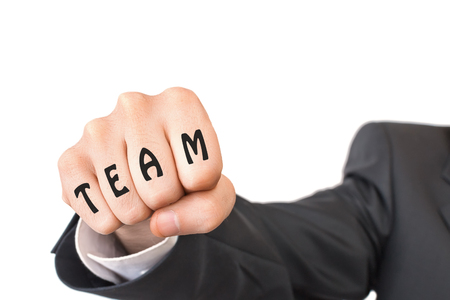 Fist with word team beats to camera - the concept of teamworkの写真素材