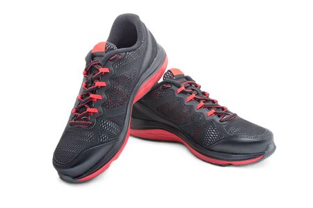 Sport black sneakers for running isolated on white backgroundの写真素材