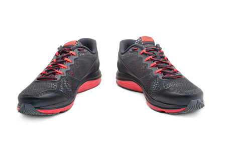 Sport black sneakers for running isolated on white backgroundの写真素材