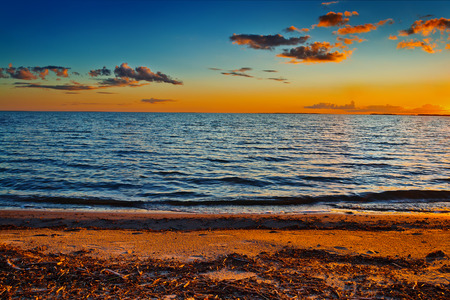 View of tranquil Chany lake during beautiful evening sunset near Kvashnino village Russia, Novosibirsk regionの写真素材