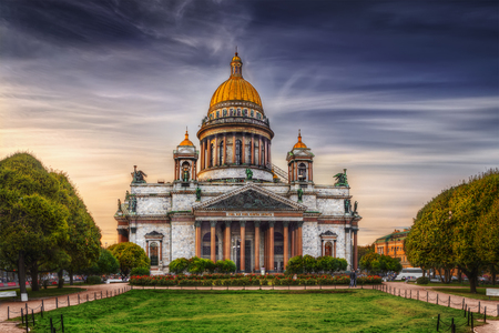 View of Isaac's Cathedral from park square in St. Petersburg (Russia).  Text (the quote from Matthew Gospel)  in Old Church Slavonic: Temple is my home, it's for praying.のeditorial素材