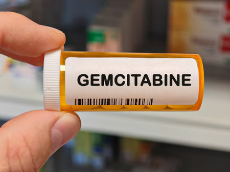 orange plastic Box of GEMCITABINE tablets on a hospital pharmacy table used to treat pancreatic and...