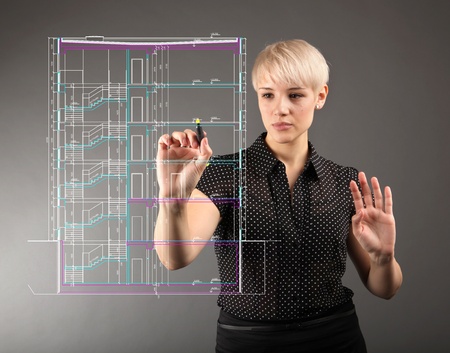 Blueprint design technical concept - girl drawing on screenの写真素材