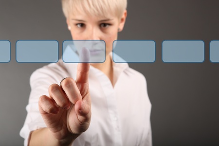 decision making concept - business woman touching screenの写真素材