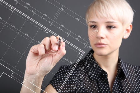 Hand and blueprint - engineer working on blue print conceptの写真素材