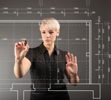 Blueprint design technical concept - girl drawing on screenの写真素材