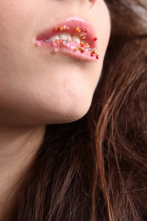 Woman open mouth with beadsの写真素材