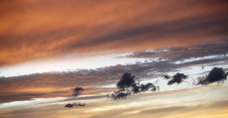 Beautiful red sunset over the italian sea, rich dark and light clouds