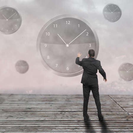Businessman standing - time strategy concept incolorの写真素材