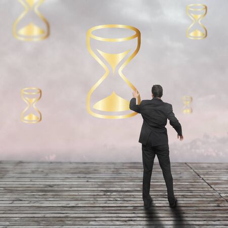 Businessman standing - time strategy concept incolorの写真素材