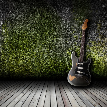 Electric guitar in the empty room conceptの写真素材