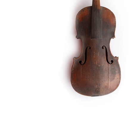 Old broken violin isolated on the white backgroundの写真素材