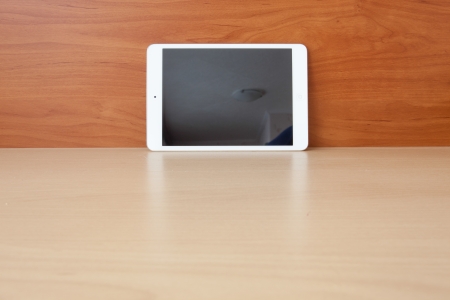 Tablet on the table with blank screenの写真素材