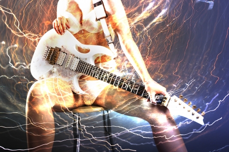 Guitar player with white electric guitar surrounded by lightningsの写真素材