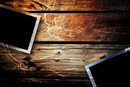 Photos lying on the wood deskの写真素材