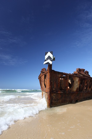 Rusty shipwreck on tropical beach - the Maheno, Fraser Island, Queensland, Australiaの写真素材