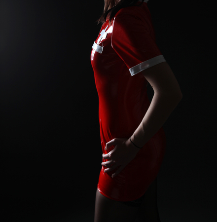 Sexy red fetish dress in studio shotの写真素材