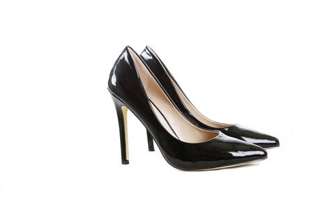 Black High heel stilleto shoes isolated on whiteの写真素材