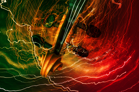 Old violin music concept with lighting effectの写真素材