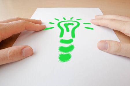 Light bulb and hand - new idea conceptの写真素材