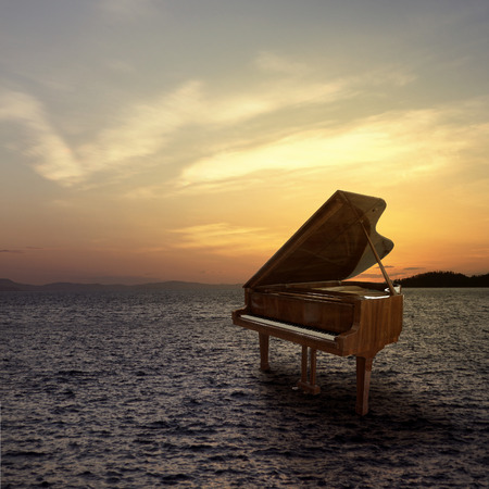 Piano outside shot at sea side during sunsetの写真素材