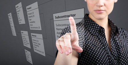 Programmer-woman designs a new database tablesの写真素材