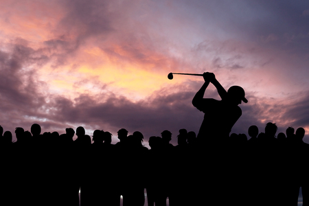 Golfer playing golf during beautiful sunset at competition eventの写真素材