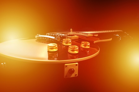 Electric guitar isolated with light effects, studio shot