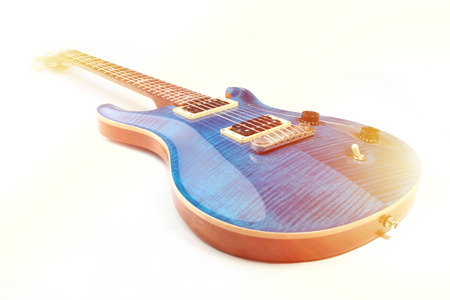 Electric guitar isolated with light effects, studio shot