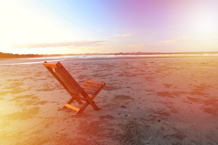 Beach wooden chair - isolated concept, Australia, East Coastの写真素材