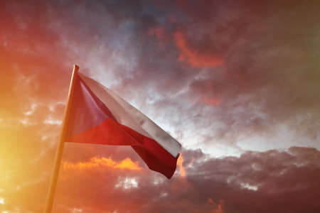 Flag of the Czech Republic flying in the wind with flag pole, isolated in bakcground, 3D rendering