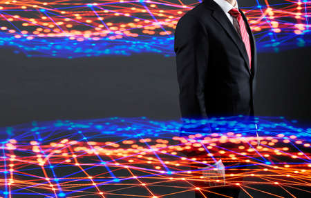 Digital transformation, businessman drawing progress on chalkboard. Concept of digitization of business processes and modern technology.の写真素材