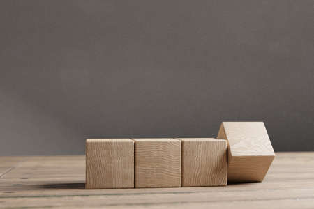 Arranged wood cube stacking as shape, mock up for create symbol or logo, business growth and management concept.の写真素材