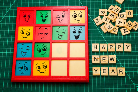 Happy smiley face on colorful wooden cubes, Happy New Year conceptの写真素材