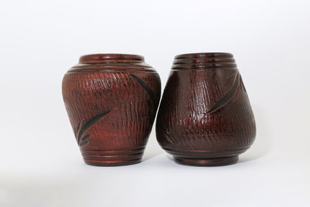Two ceramic jars of similar size arranged in a symmetrical shape create a balanced composition.の写真素材