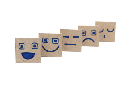 Simple, hand-drawn emojis, arranged in a sequence, showcasing a spectrum of emotions.の写真素材