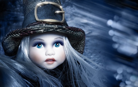 Fantastical stylized portrait of an antique ceramic doll with winter wonderland backgroundの写真素材