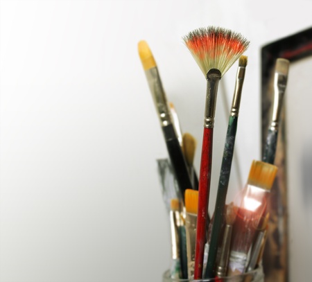 A group of artist paint brushes in modern white studio spaceの写真素材